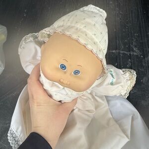 Adorable Baby Doll with Blue Eyes